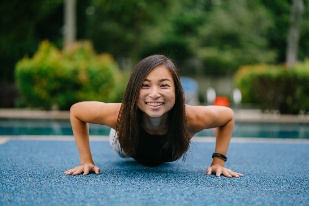 teen girl doing pushups