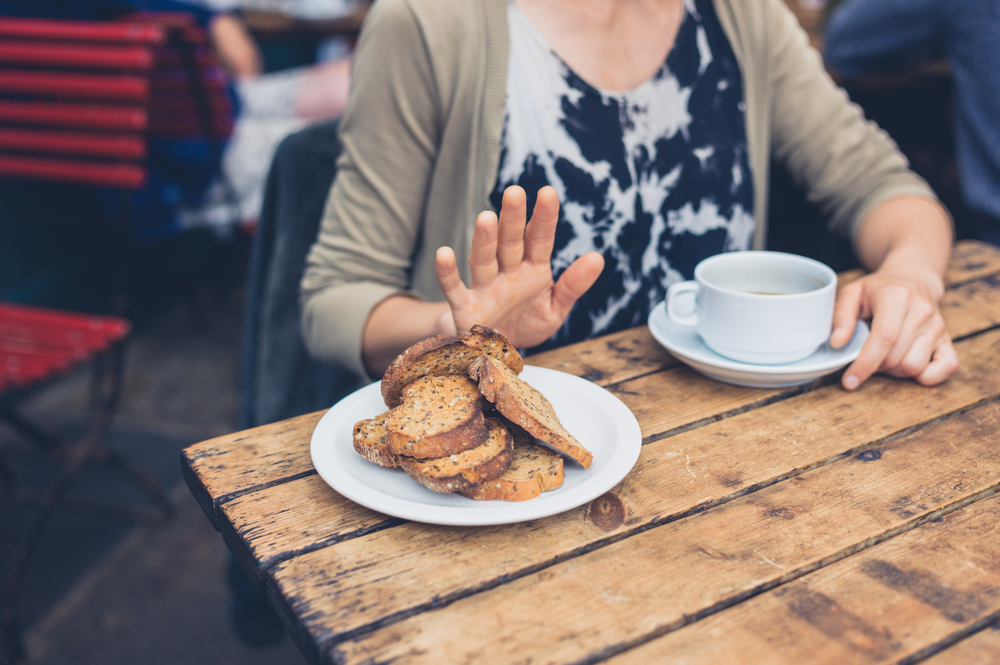 a woman saying no to bread