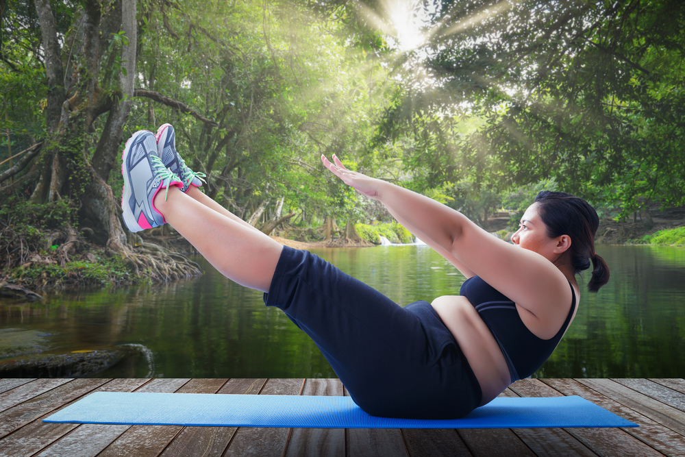 an overweight woman exercising