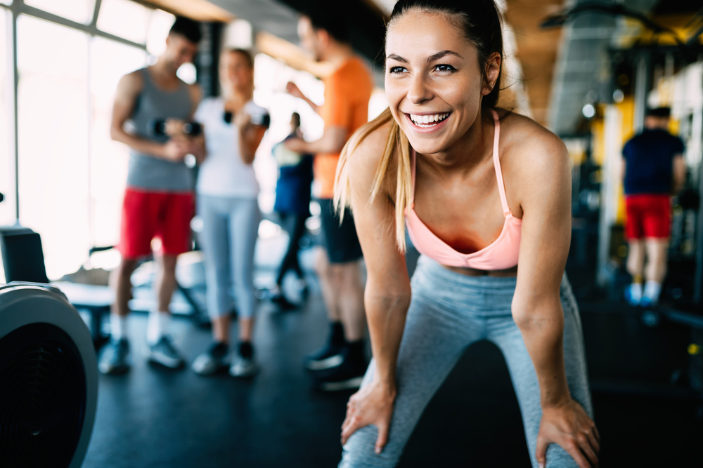 a woman smiling after exercising