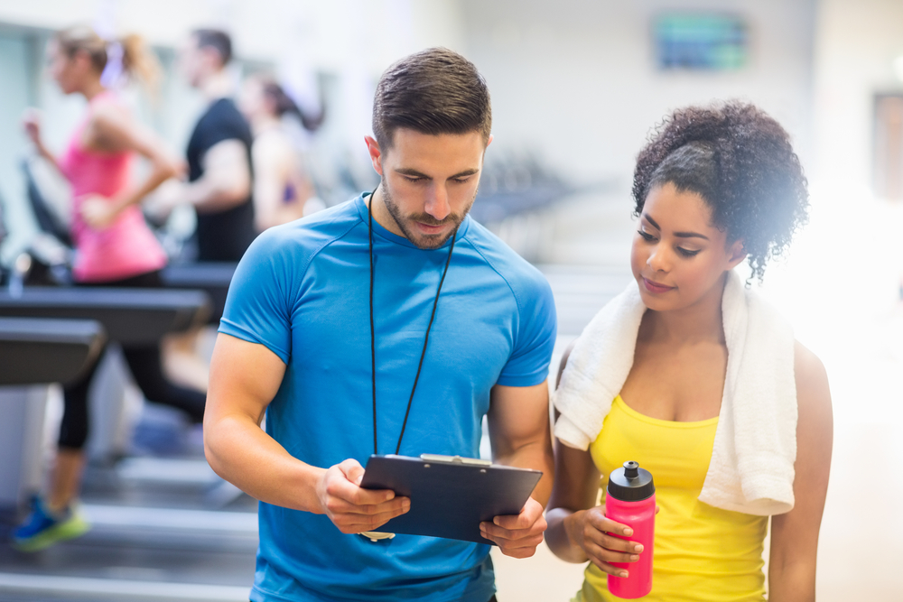 a woman working with her personal trainer