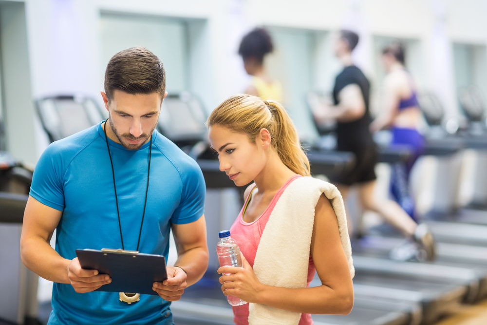 a personal trainer talking with consultant