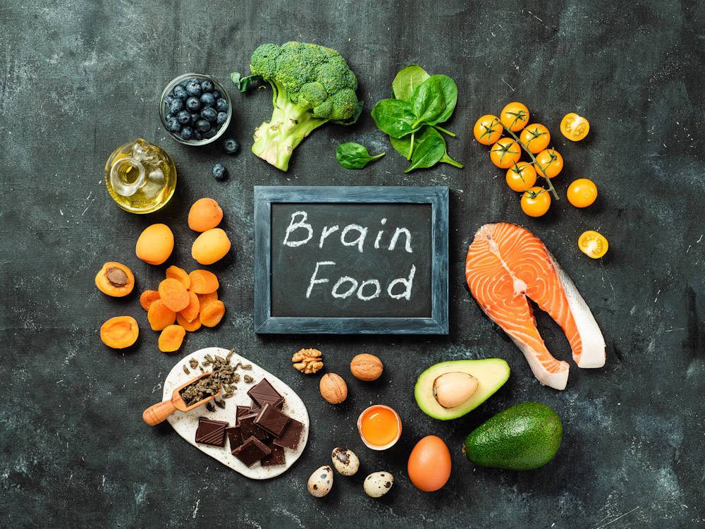 An array of foods that are optimal for healthy brain function as included in a customized fitness plan