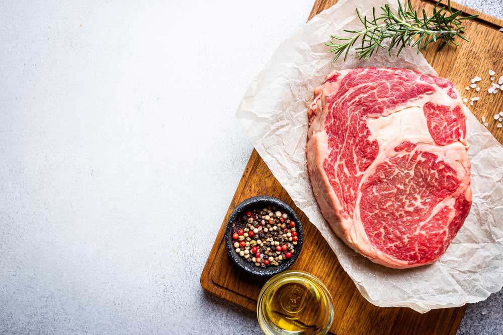 Raw steak ready for preparation.